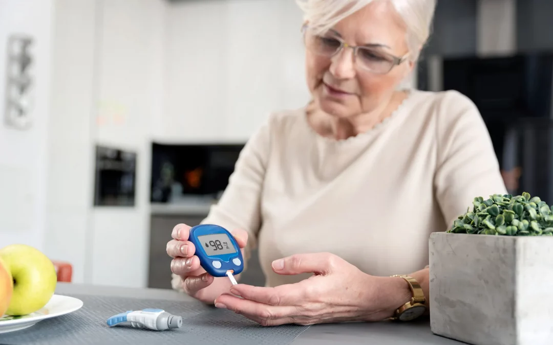 An image of an older patient testing their blood sugar with a glucometer.