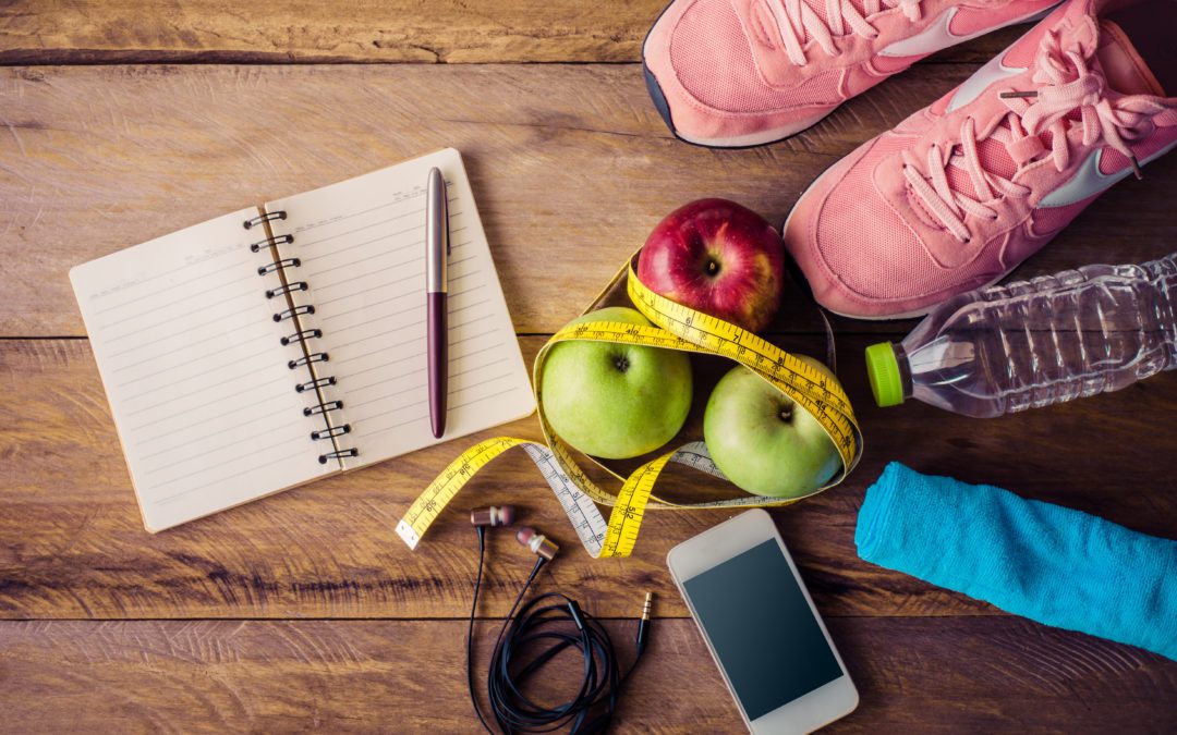 An image with items that can help prevent type 2 diabetes such as work out shoes, apple, a water bottle and journal.