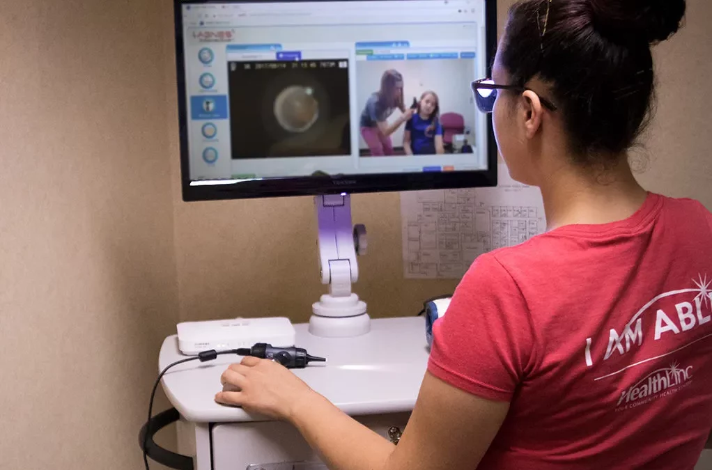 A photo of a HealthLinc employee conducting a telehealth appointment.